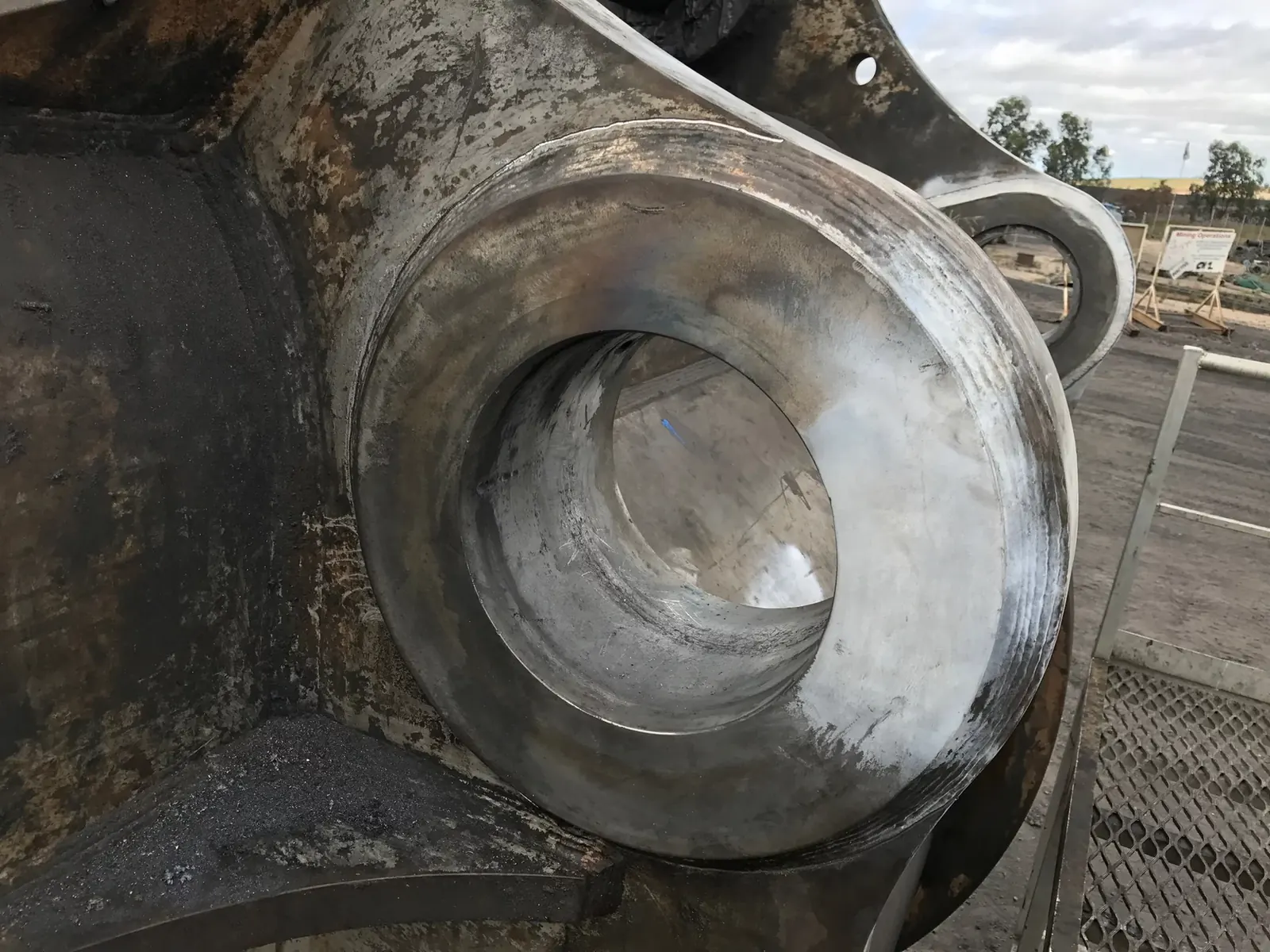 Treated weld around a bearing boss on a construction machine