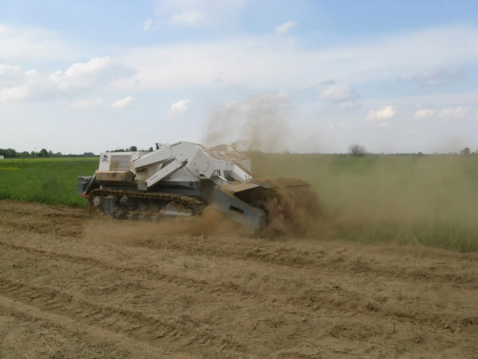 Tracked machine working a field
